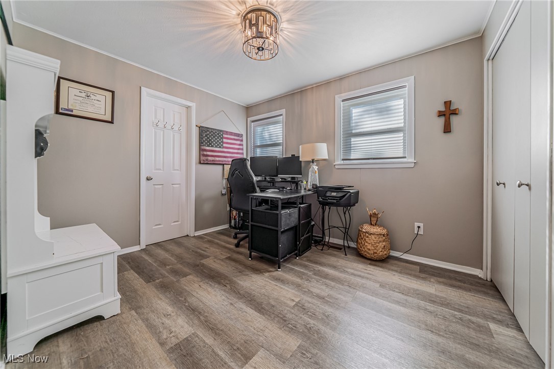595 Moorfield Road Fairlawn, OH 44313 - Photo 33 of 50 Home office featuring light wood finished floors and a chandelier