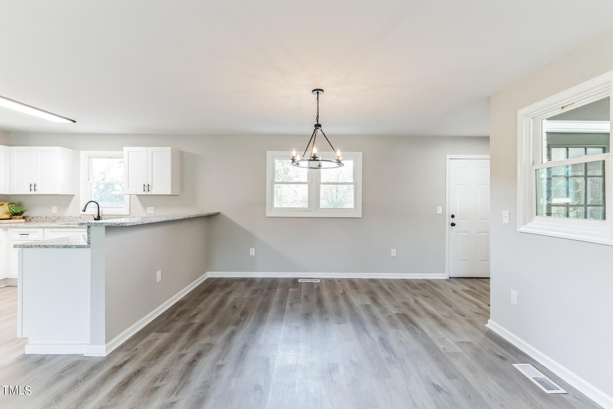 2395 Highway 210 Garland, NC 28441 - Photo 13 of 30 a view of a kitchen with wooden floor electronic appliances and window