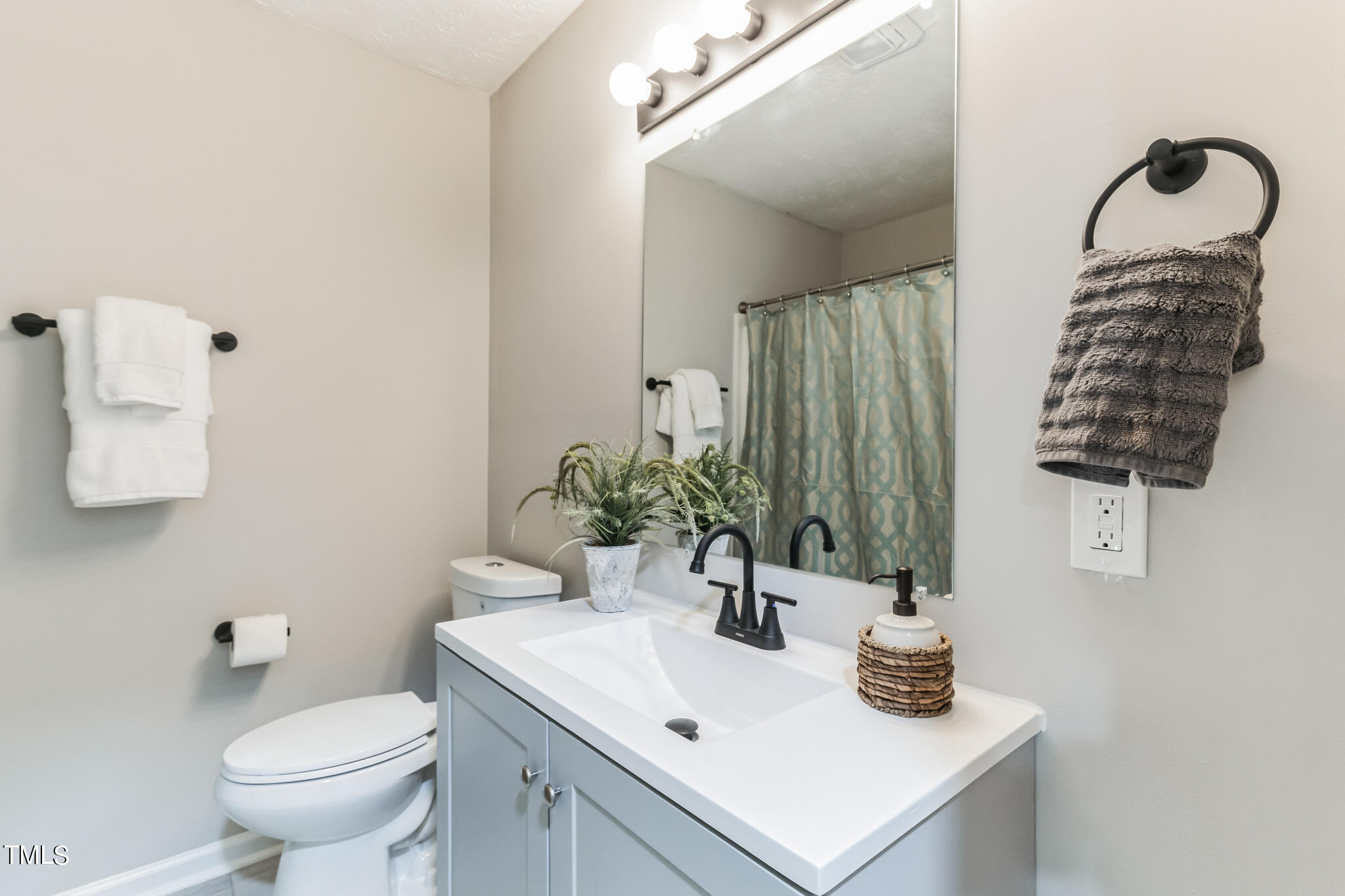 2395 Highway 210 Garland, NC 28441 - Photo 16 of 30 a bathroom with a sink toilet and mirror