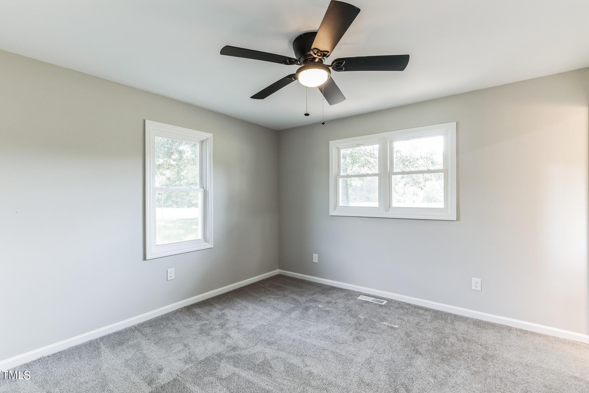 2395 Highway 210 Garland, NC 28441 - Photo 24 of 30 an empty room with a window and a fan