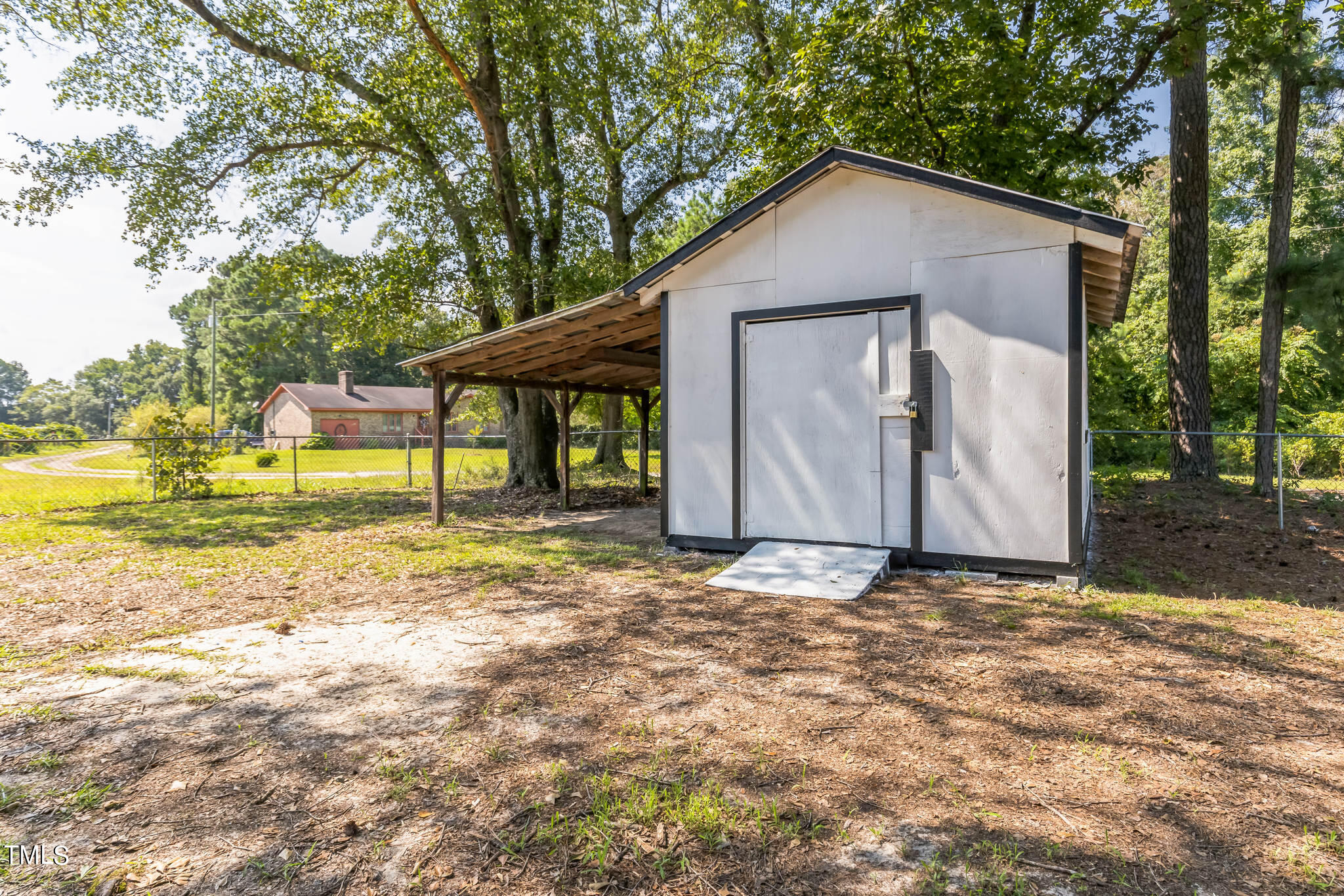 2395 Highway 210 Garland, NC 28441 - Photo 30 of 30 a view of a house with backyard and trees