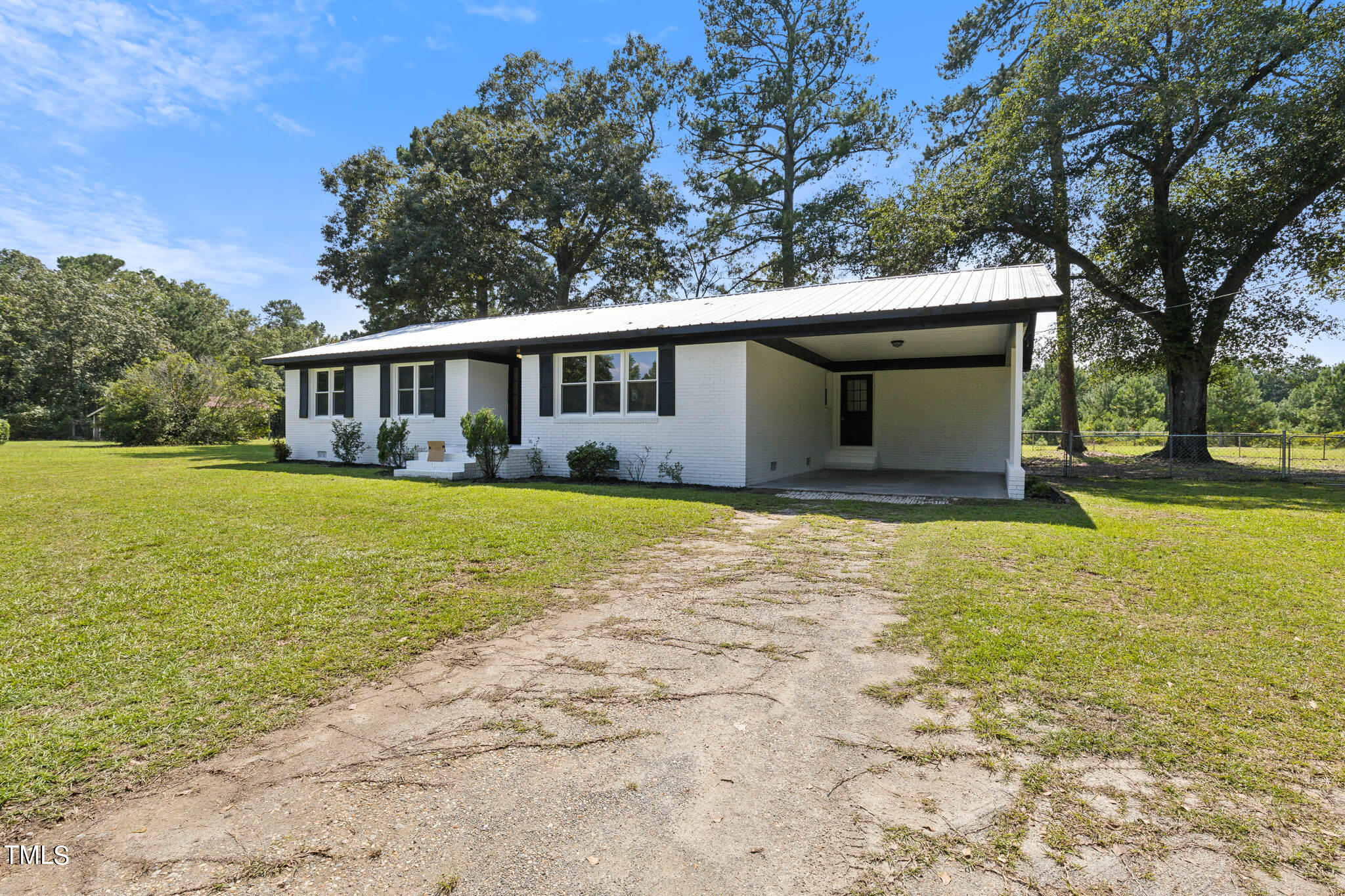 2395 Highway 210 Garland, NC 28441 - Photo 3 of 30 a view of house with yard and trees in the background