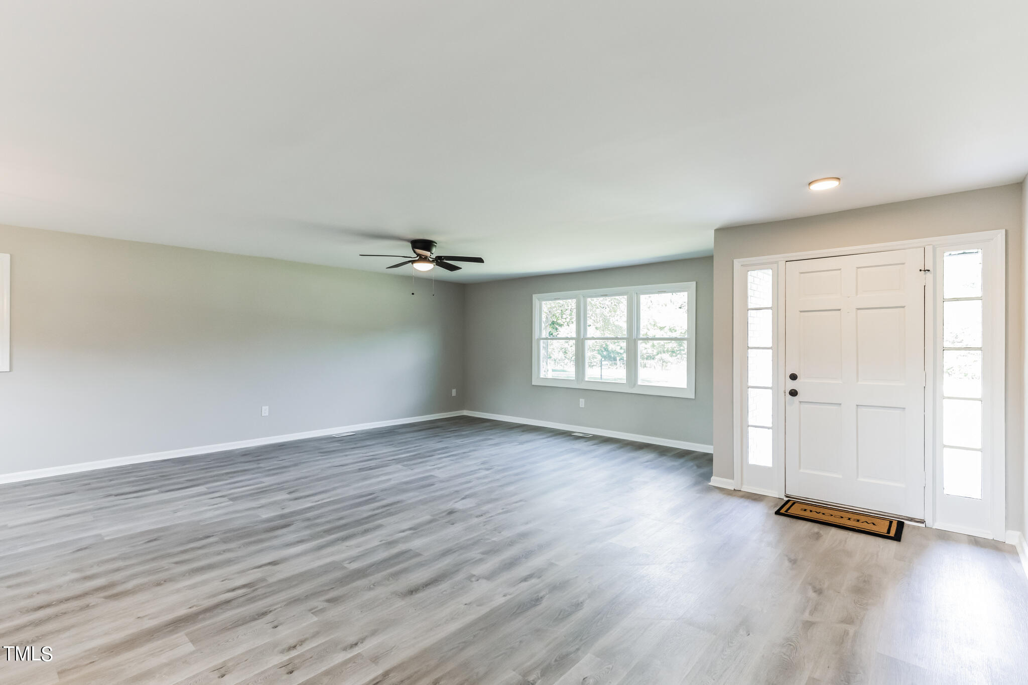2395 Highway 210 Garland, NC 28441 - Photo 4 of 30 wooden floor in an empty room with a window