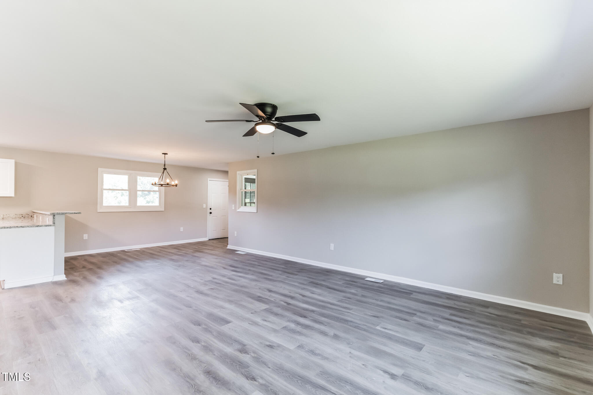 2395 Highway 210 Garland, NC 28441 - Photo 6 of 30 wooden floor in an empty room with a window