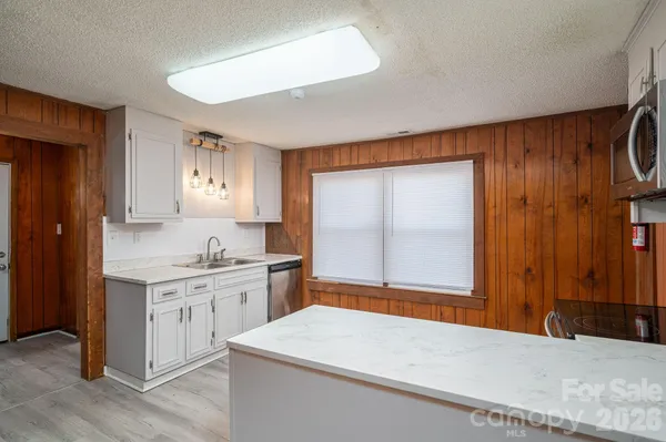 a room with a sink and a mirror