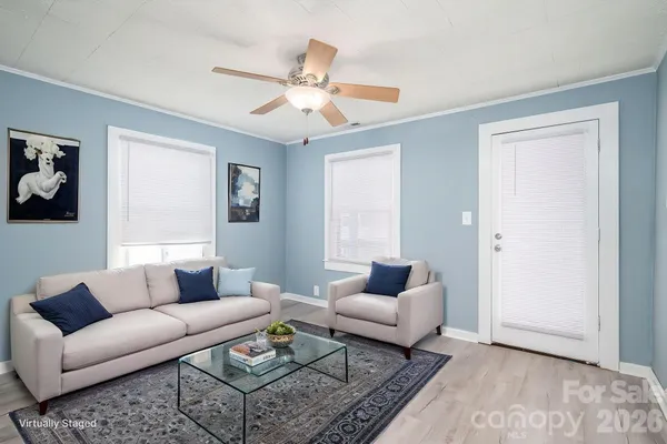 a living room with furniture and a window