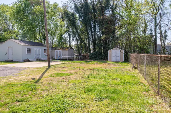 a swimming pool with some trees in the background
