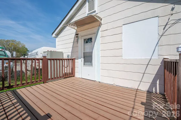 a balcony with wooden floor