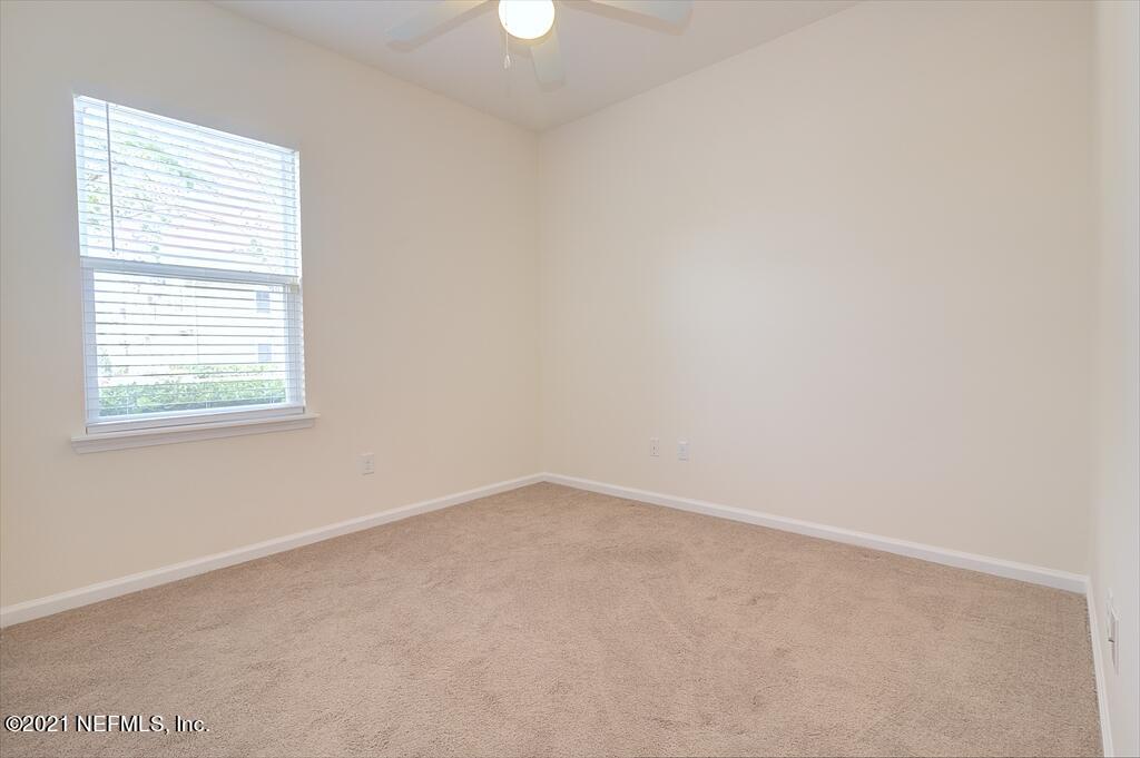 2211 Golden Lake Loop St. Augustine, FL 32084 - Photo 11 of 29 an empty room with a window