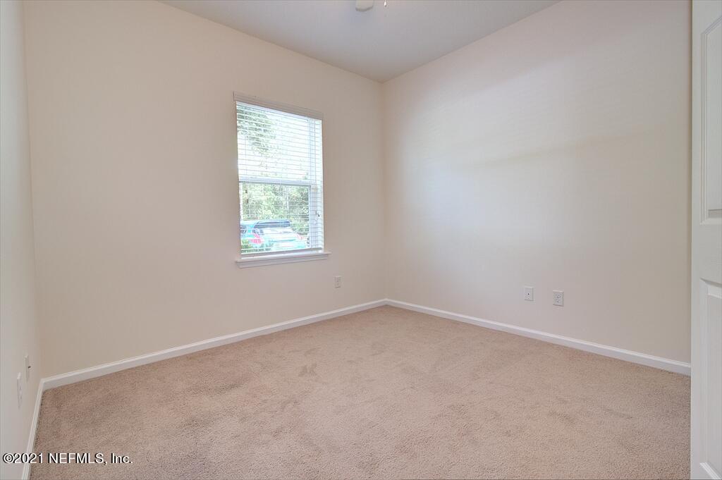 2211 Golden Lake Loop St. Augustine, FL 32084 - Photo 14 of 29 an empty room with a window