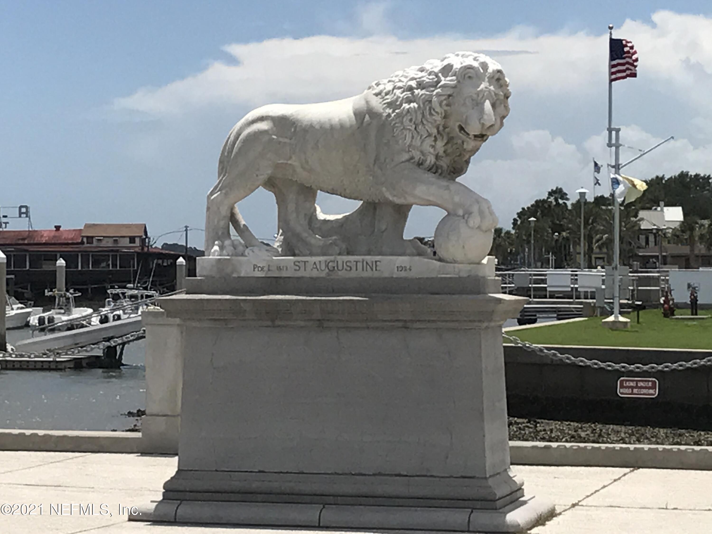 2211 Golden Lake Loop St. Augustine, FL 32084 - Photo 20 of 29 a living room with a table and chairs