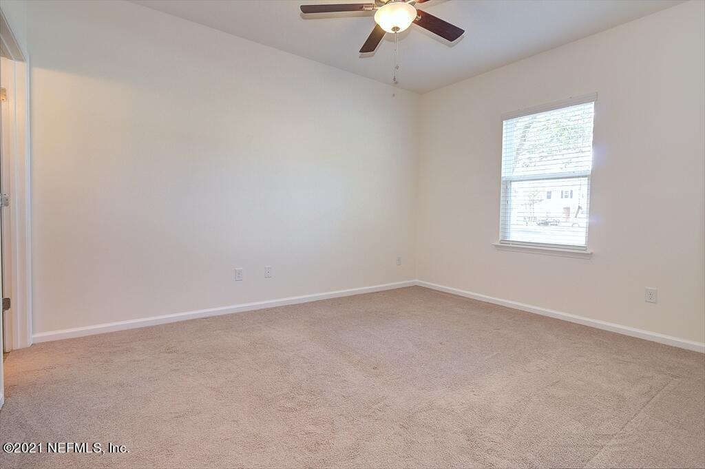 2211 Golden Lake Loop St. Augustine, FL 32084 - Photo 8 of 29 an empty room with a window