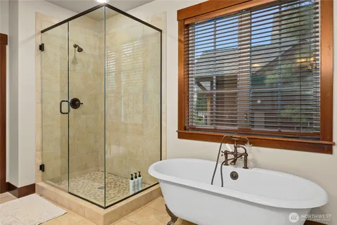 a spacious bathroom with a granite countertop sink mirror and double