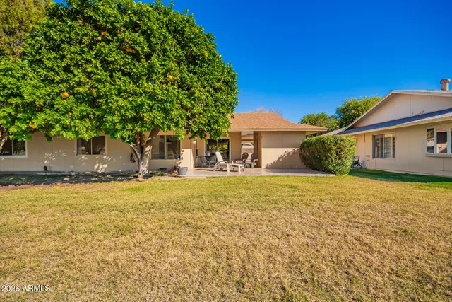 a view of a swimming pool with a table and chairs