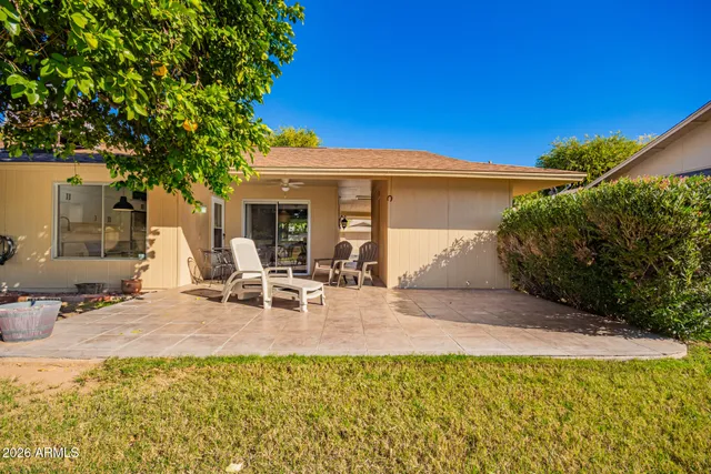 a front view of a house with a garden