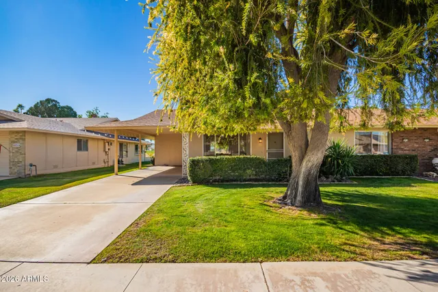 a view of house with outdoor space and garden