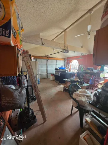 a couple of cars parked in front of a building