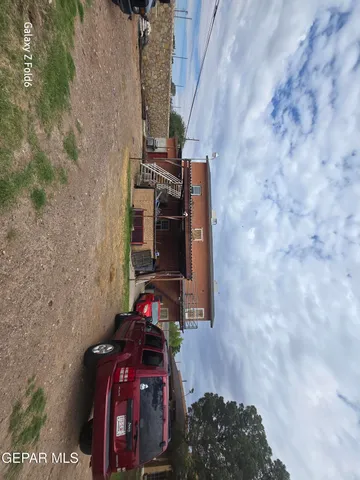 a bedroom with a bed and flat screen tv
