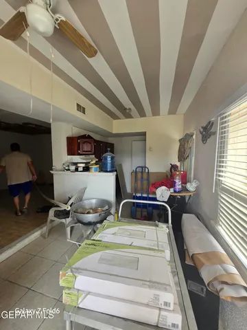 a bed room with furniture and a chandelier