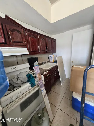 an empty room with a empty space and windows