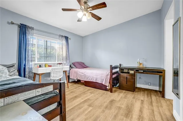 a bedroom with furniture and a window