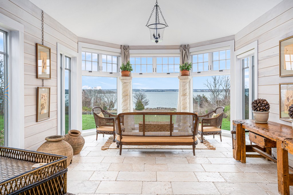 256 East Shore Road Jamestown, RI 02835 - Photo 7 of 40 SITTING ROOM WITH WATER VIEWS AND FLOOR TO CEILING WINDOWS