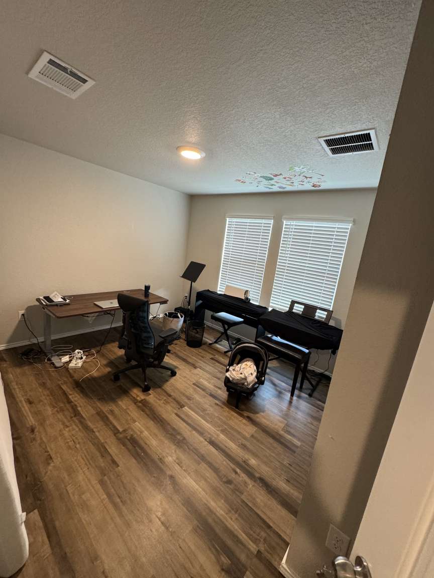 6320 Diamondleaf Bend Austin, TX 78724 - Photo 3 of 11 a living room with chairs and a wooden floor