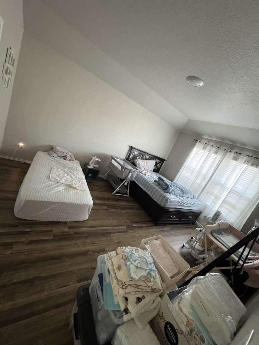 6320 Diamondleaf Bend Austin, TX 78724 - Photo 9 of 11 a bedroom with furniture and a chandelier