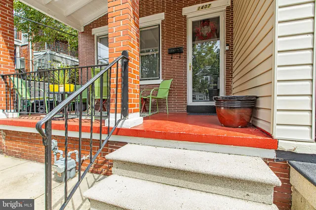 a kitchen with stainless steel appliances granite countertop a refrigerator and a stove