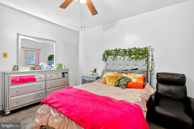 a bedroom with bed and window