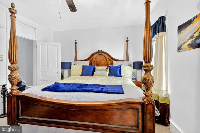 a bedroom with furniture and a window