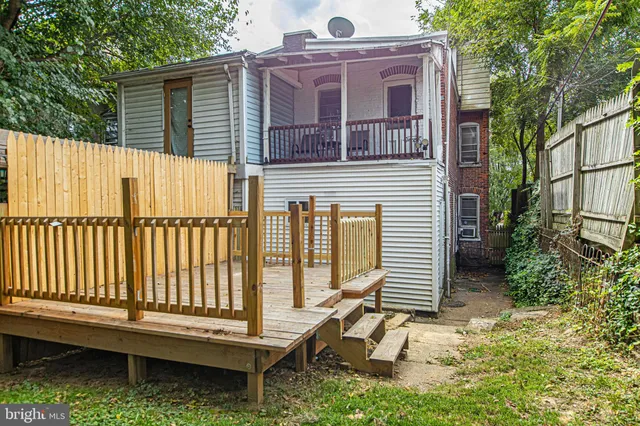 a backyard of a house with a deck
