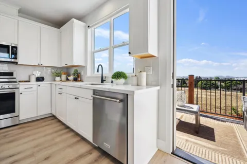 a kitchen with a sink cabinets and counter