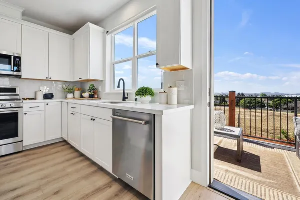 a kitchen with a sink cabinets and counter