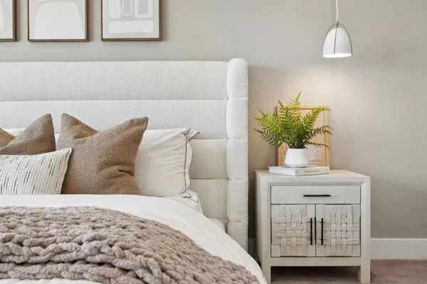 a living room with furniture a mirror and a large window