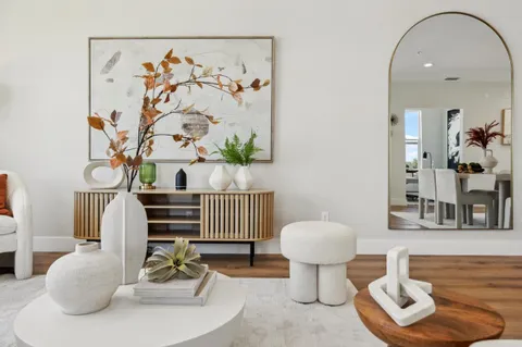 a living room with furniture and a painting