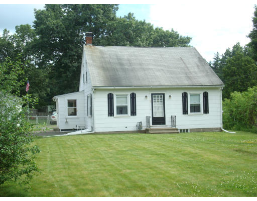 7 Couture Road Southampton, MA 01073 - Photo 3 of 13 a house that has a big yard in front of it