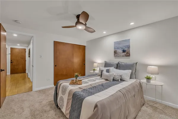 a bedroom with bed and a chandelier