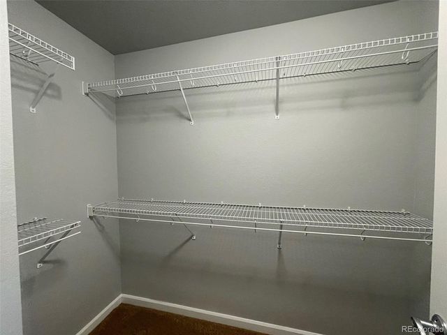 a view of a room with racks on the wall