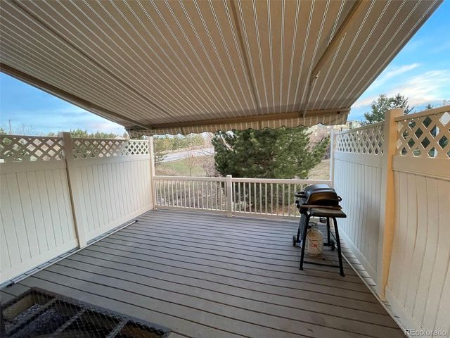 a balcony with wooden floor