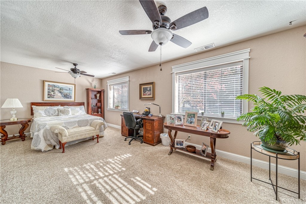 704 Miller Avenue Chico, CA 95928 - Photo 12 of 38 a bedroom with a bed and a desk