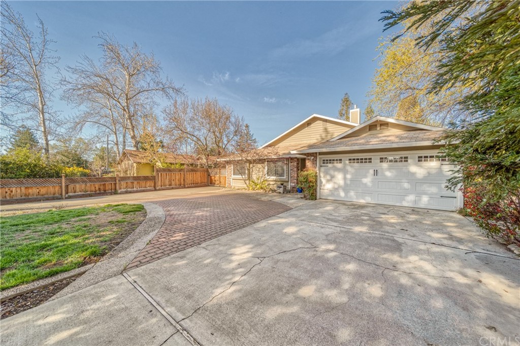704 Miller Avenue Chico, CA 95928 - Photo 2 of 38 a view of a large house with a yard and large tree