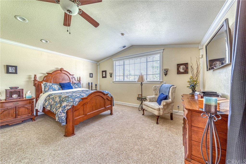 704 Miller Avenue Chico, CA 95928 - Photo 21 of 38 a bedroom with a bed and wooden floor