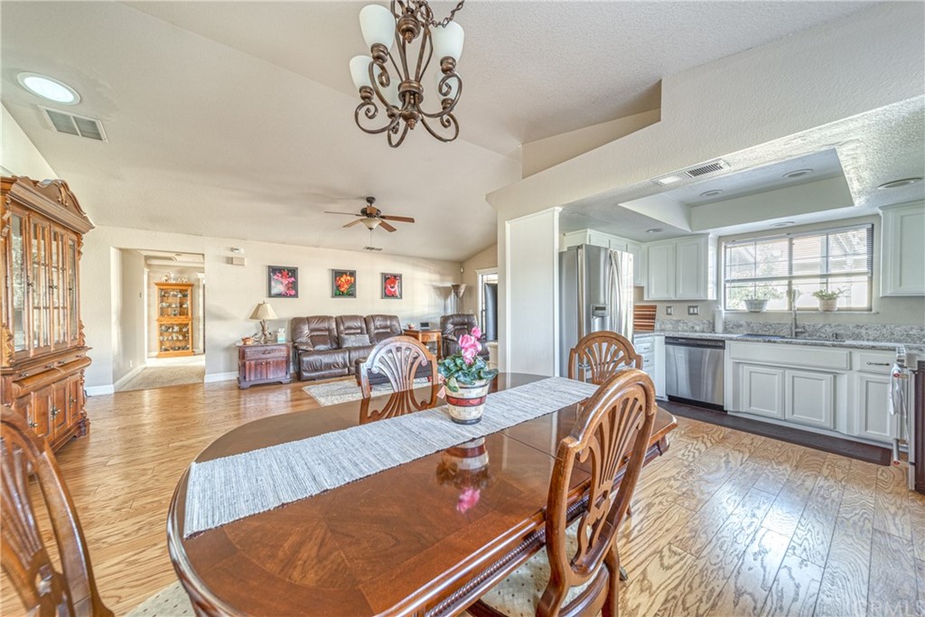 704 Miller Avenue Chico, CA 95928 - Photo 7 of 38 a very nice looking living room with kitchen and a wooden floor
