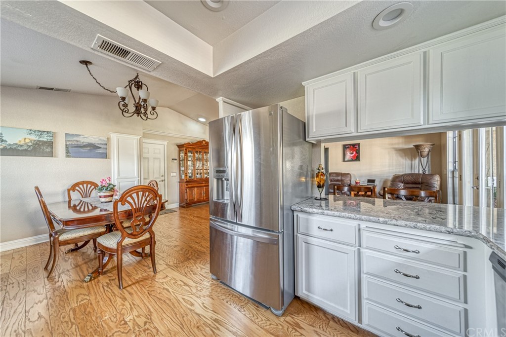 704 Miller Avenue Chico, CA 95928 - Photo 10 of 38 a kitchen with granite countertop cabinets and stainless steel appliances