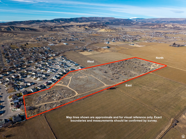 View of rural area with property parcel outlined and a mountainous background