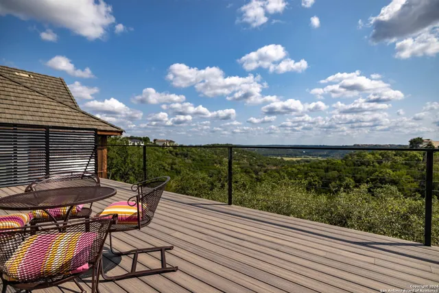 a view of a balcony with furniture