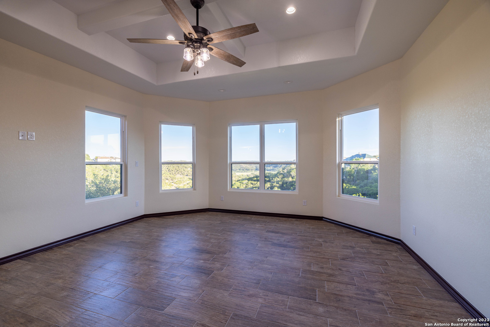 86 Hannah Lane Boerne, TX 78006 - Photo 24 of 45 a view of livingroom with window hardwood floor and a ceiling fan