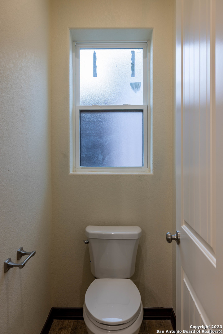 86 Hannah Lane Boerne, TX 78006 - Photo 29 of 45 a white toilet sitting next to a bathroom sink