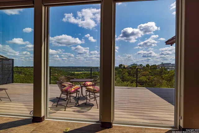 a view of a balcony with sitting area